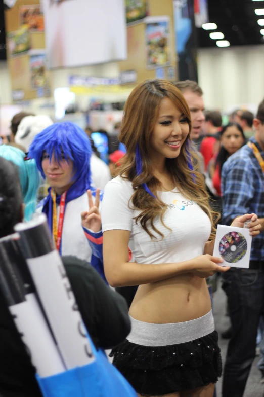 a girl is displaying her body at an anime convention