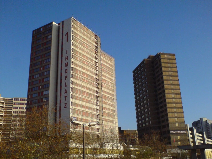 tall buildings in the distance with buildings lining both sides