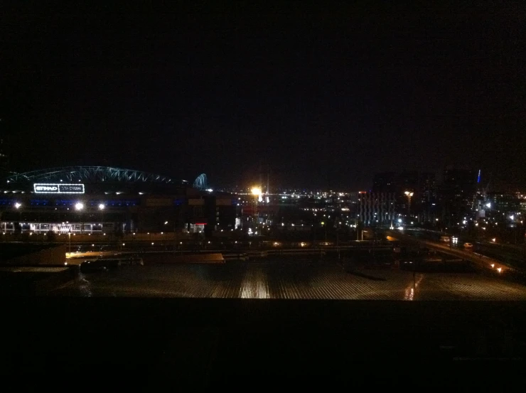 a city at night with some buildings lit up