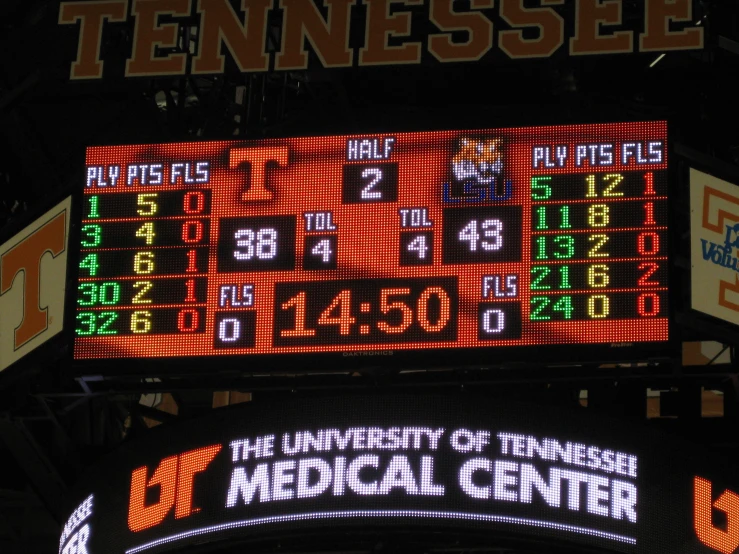 the score board shows a set of plays during a college basketball game