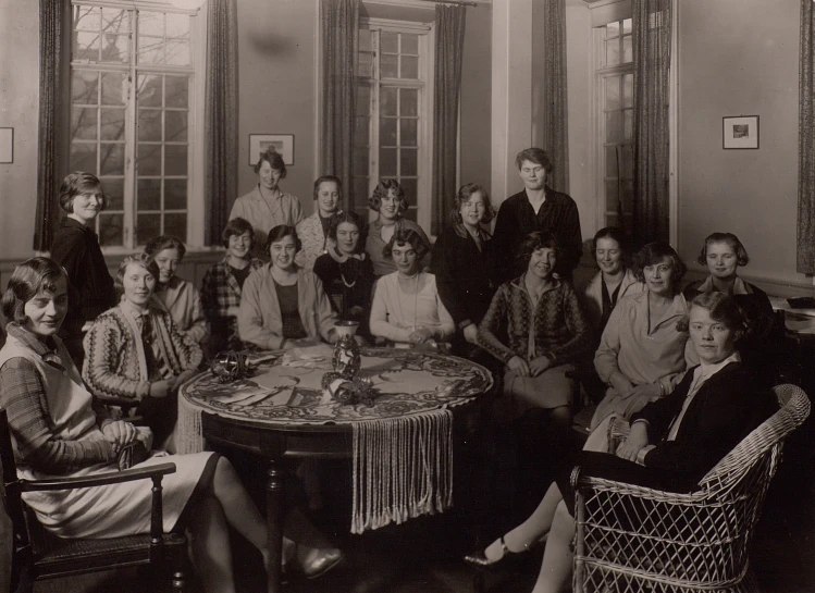 a group of women gathered around a dining table