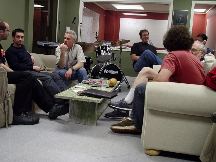 several men in the living room of an apartment