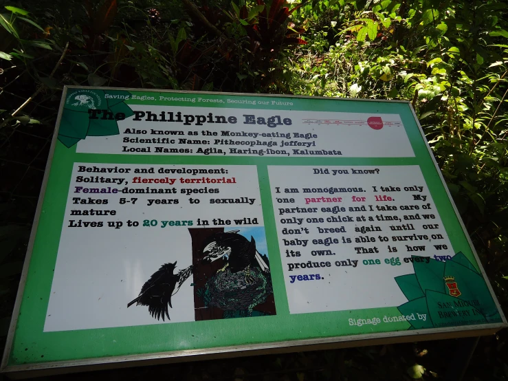 a sign is displayed on the side of the road