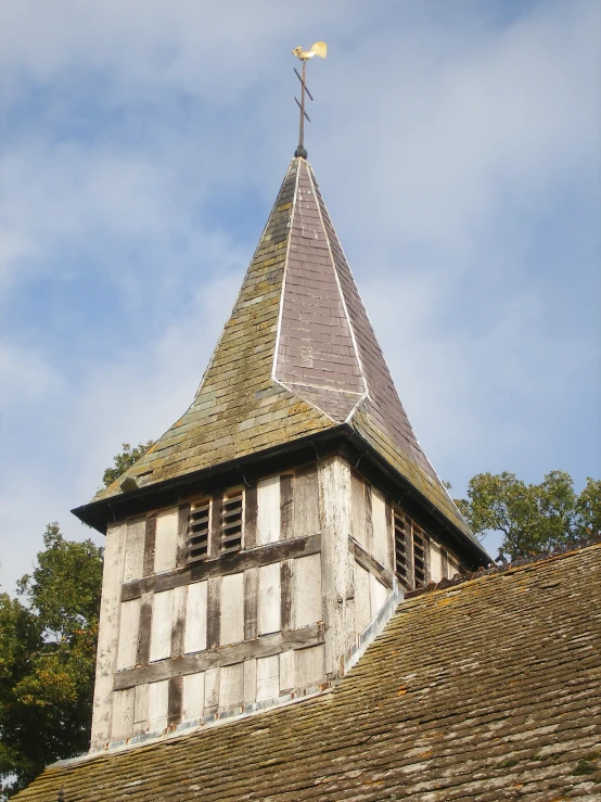 an old building with a clock tower and a belltower