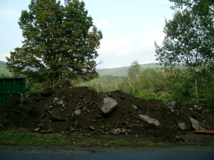 there are many small piles of dirt and rocks