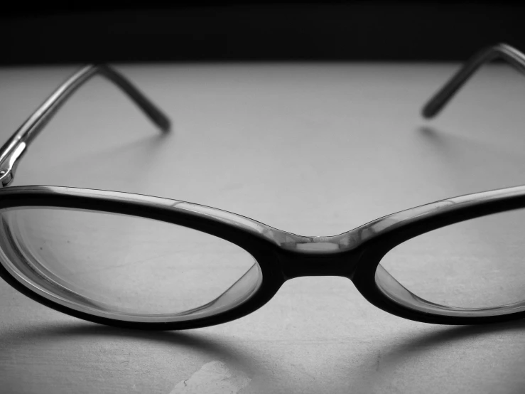 glasses on a table on a black and white po