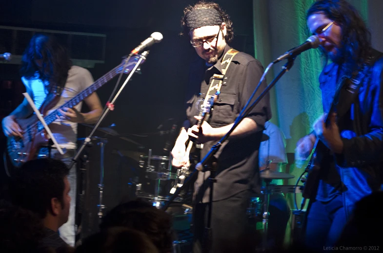 a band with instruments playing on stage during the day