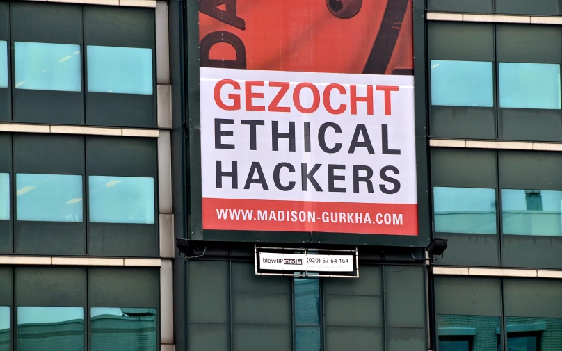 a sign in front of a building that says gezoch political hackers