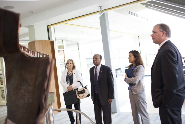 people standing around talking in a lobby