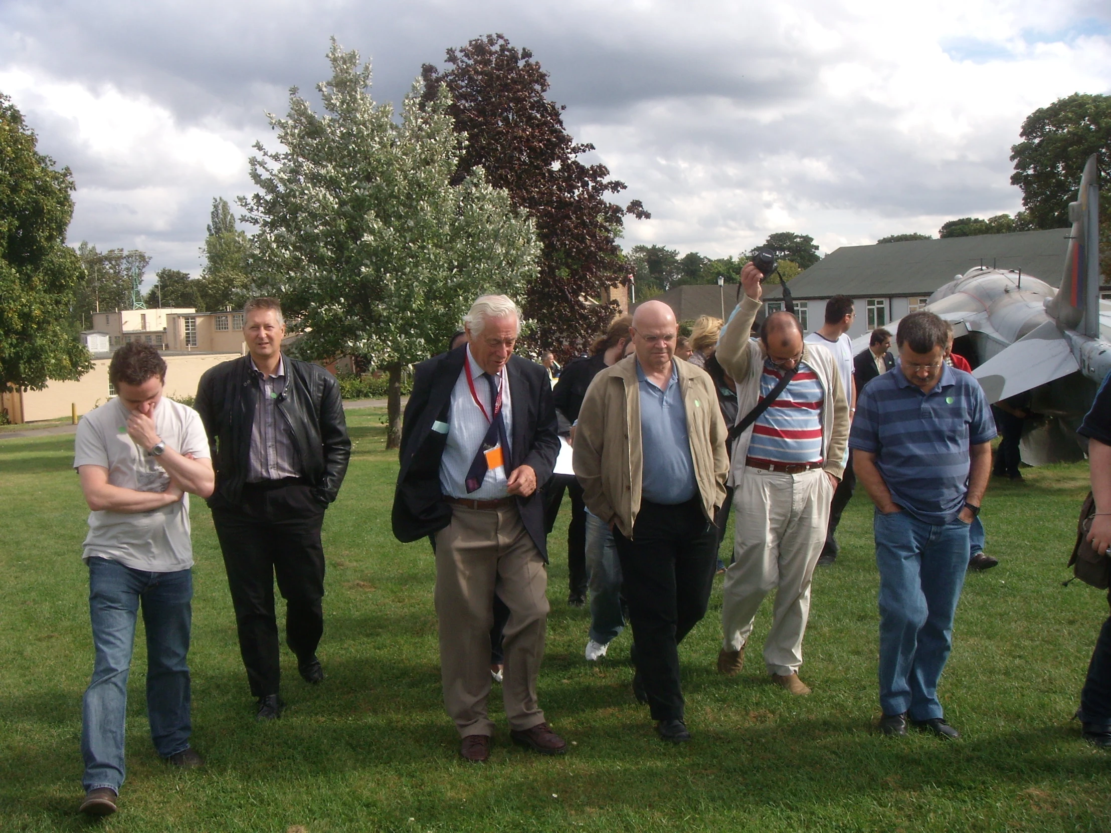 there are many people standing in a field