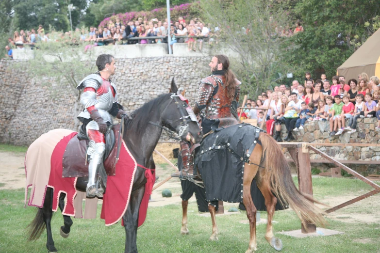 a pair of knights on horses playing a game