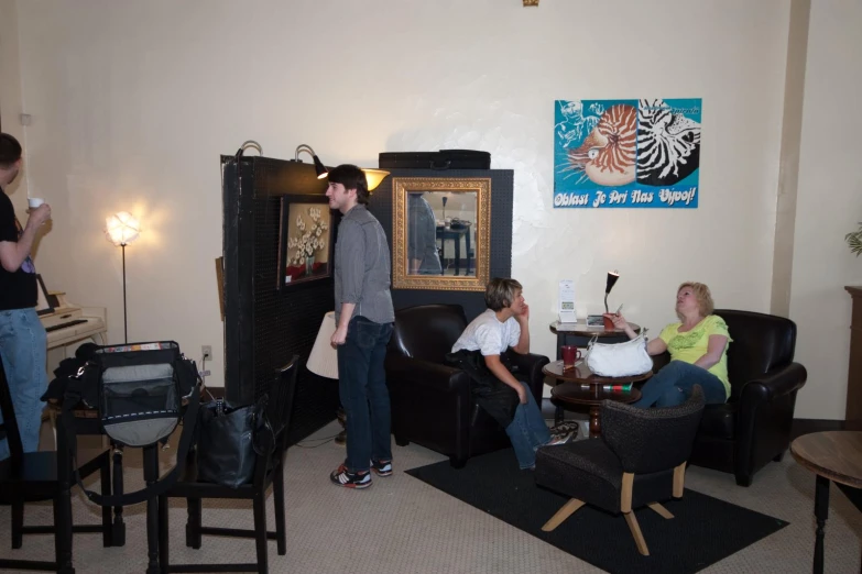 people gathered around in a living room area