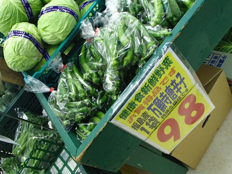 fresh vegetables in bags for sale in a grocery store