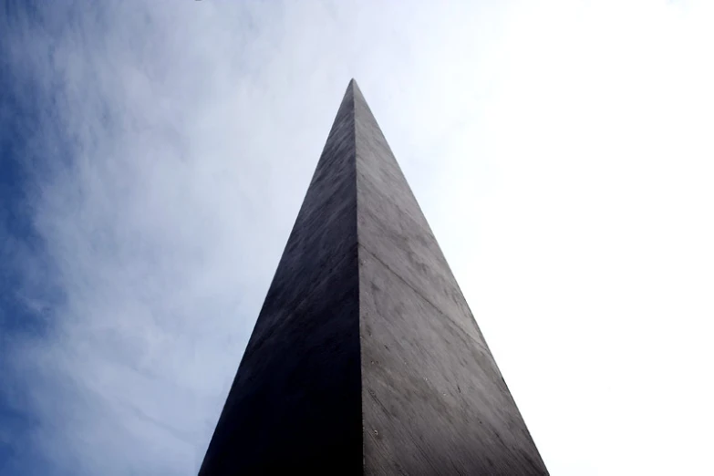 a tall monument with the words washington d c and an american flag on it