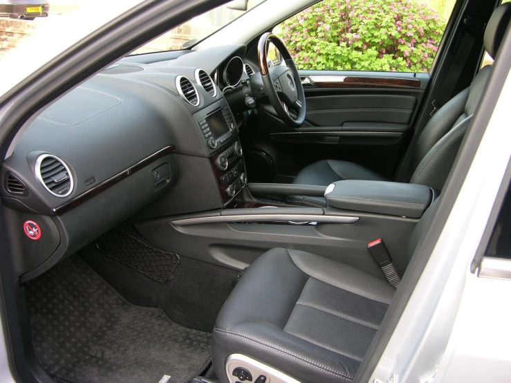 the inside of a car has a dashboard and steering wheel