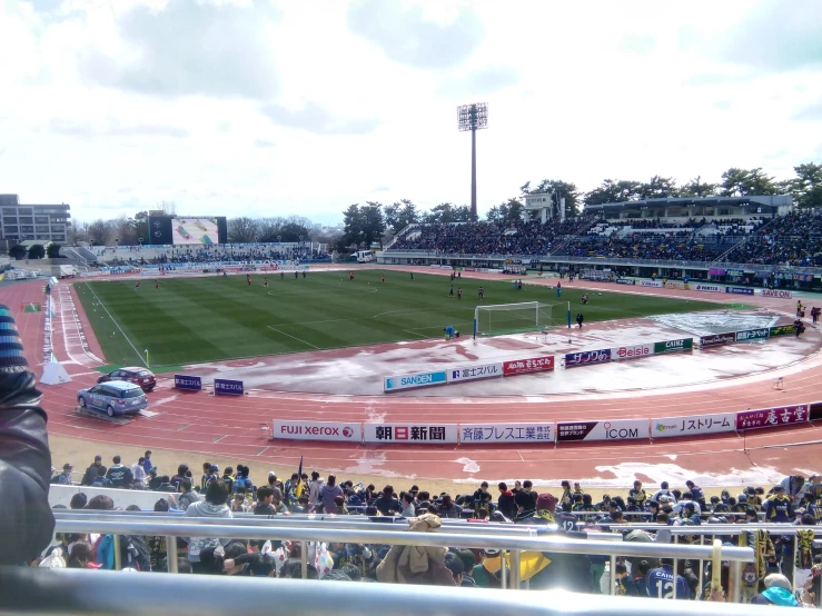 the large field at a stadium full of people