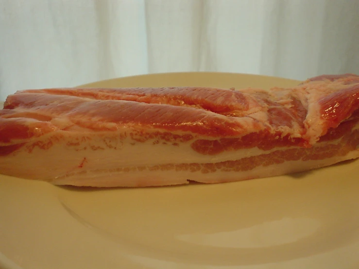 a piece of meat that has been wrapped in bacon