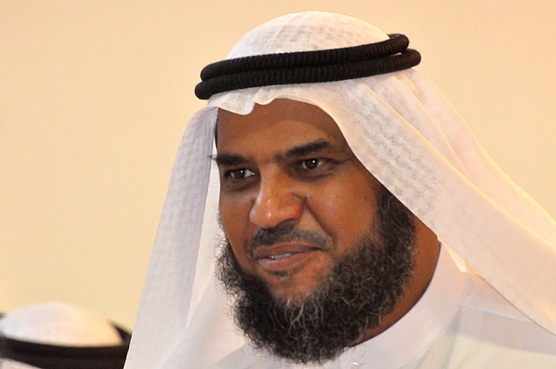 a man wearing a veil with a beard and headband