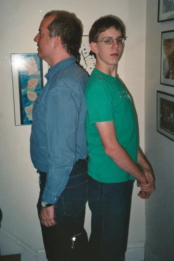 two people standing together in a room