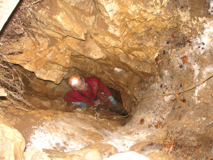a man with his head down in the cave