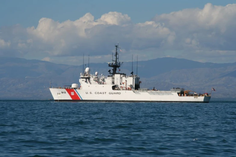 a large white ship is on the water