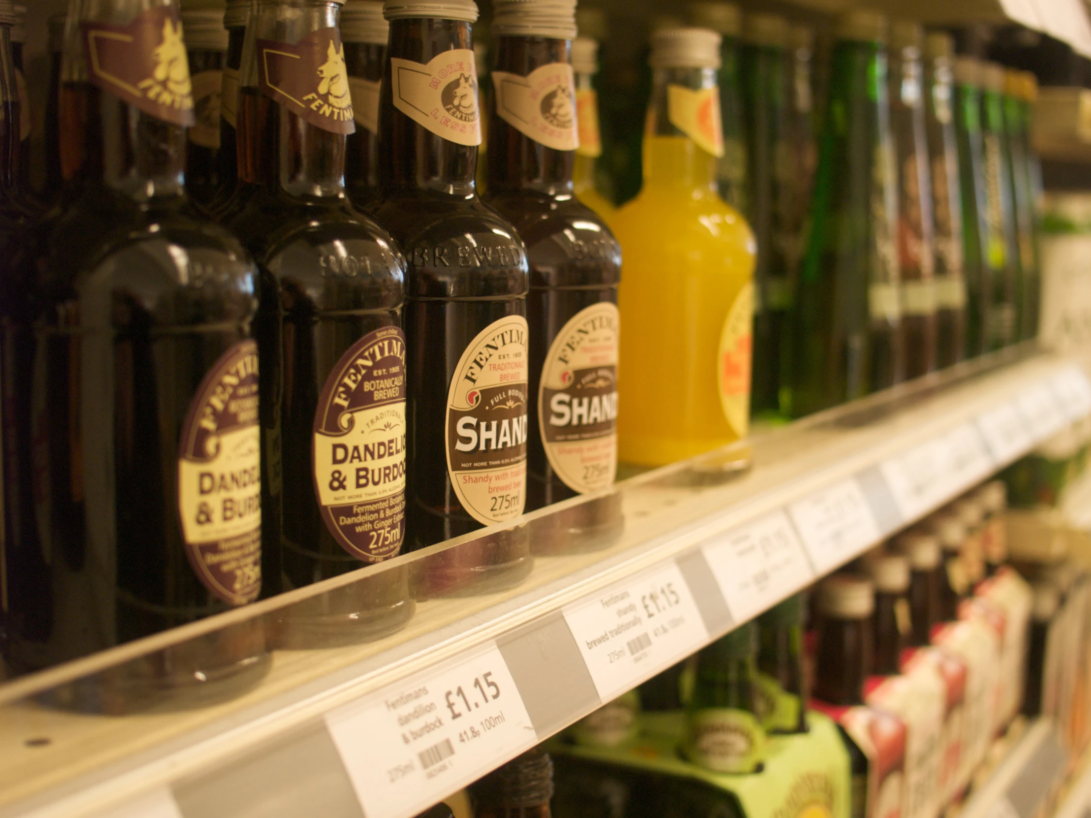 a display of different alcoholic beverages in a supermarket