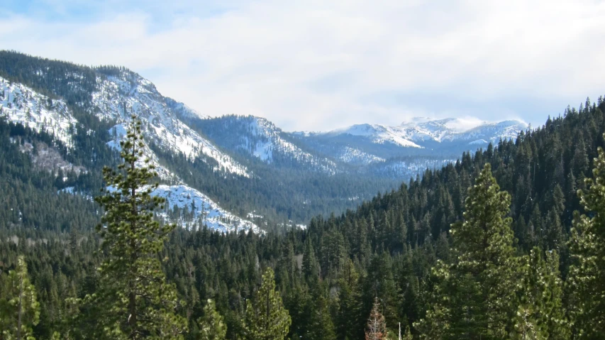 a scenic mountain range with some snow on it