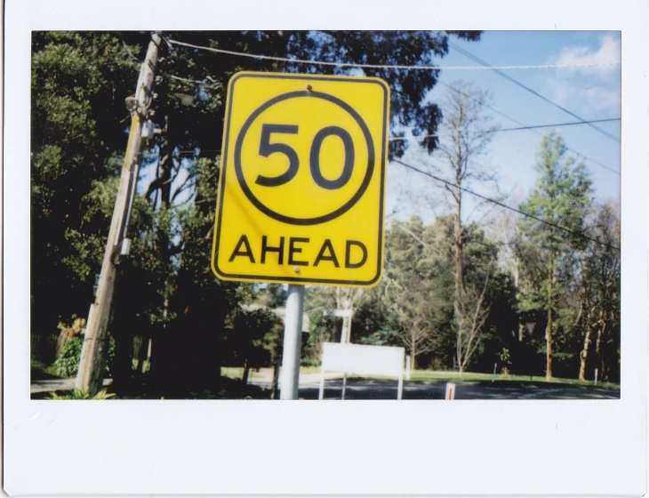 a road sign on the side of the road saying ahead