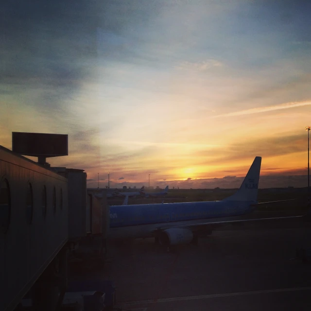 a large passenger jetliner sitting on top of an airport tarmac