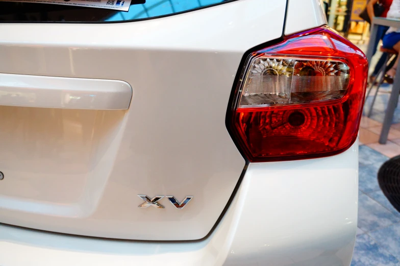 a close up of the tail light of a white car