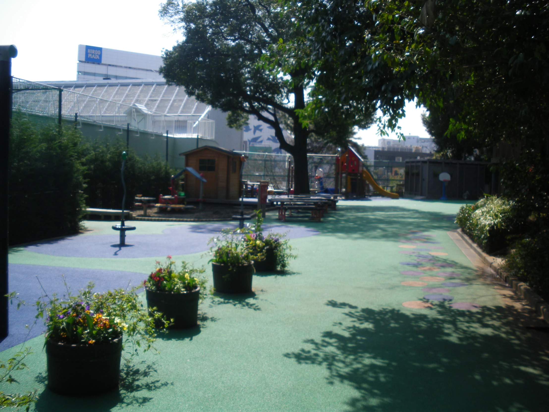 children's play area with small children's slides in the distance