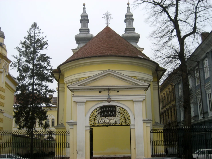 a building with domes on top and a gate