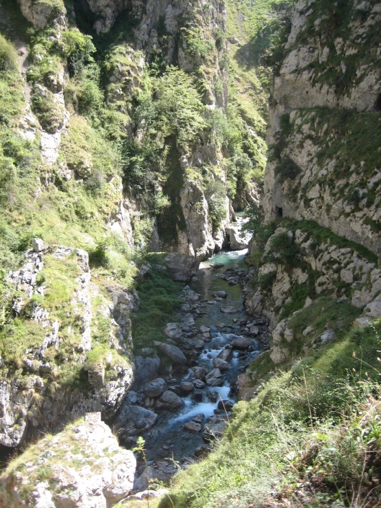 a narrow canyon filled with lots of rocks