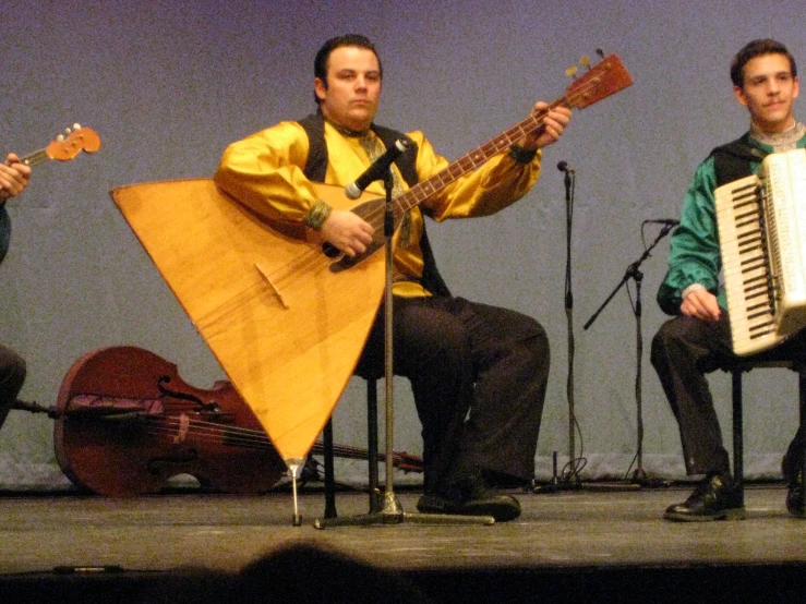 an image of two people playing the music