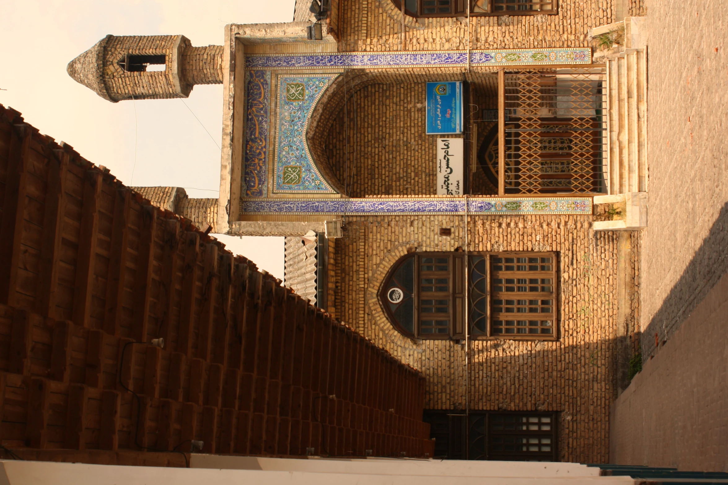 a small brick building with large arches