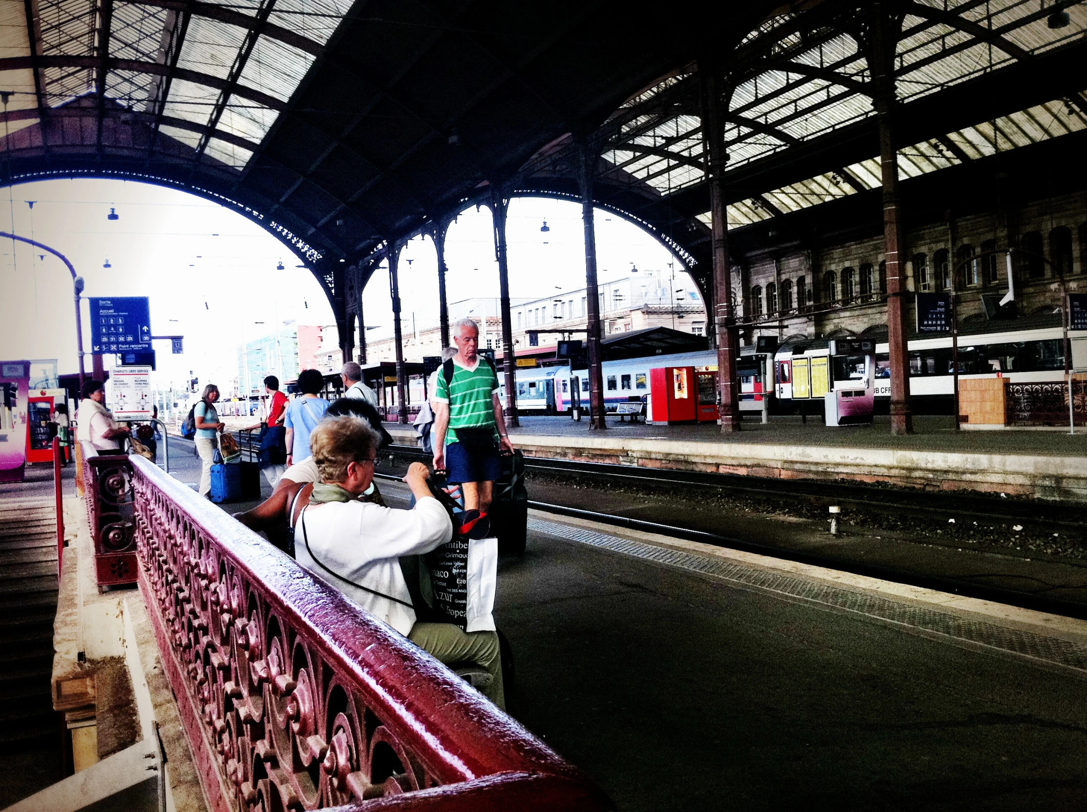 some people waiting for the train in a station