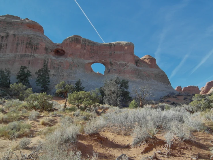 a view of the landscape of arches and hills from a distance