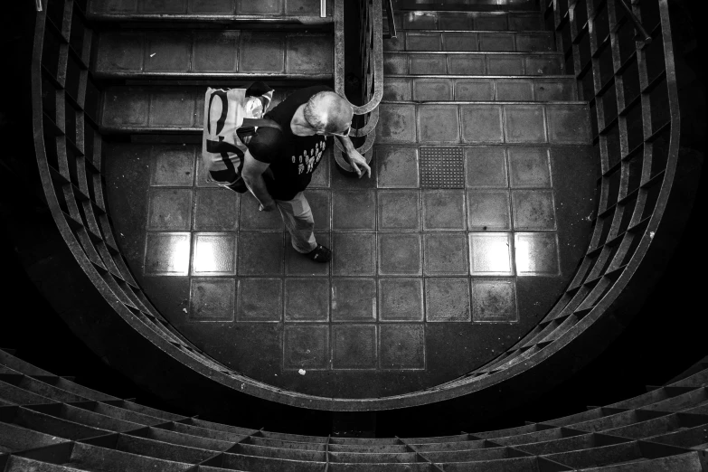 a person walking up the steps in a building