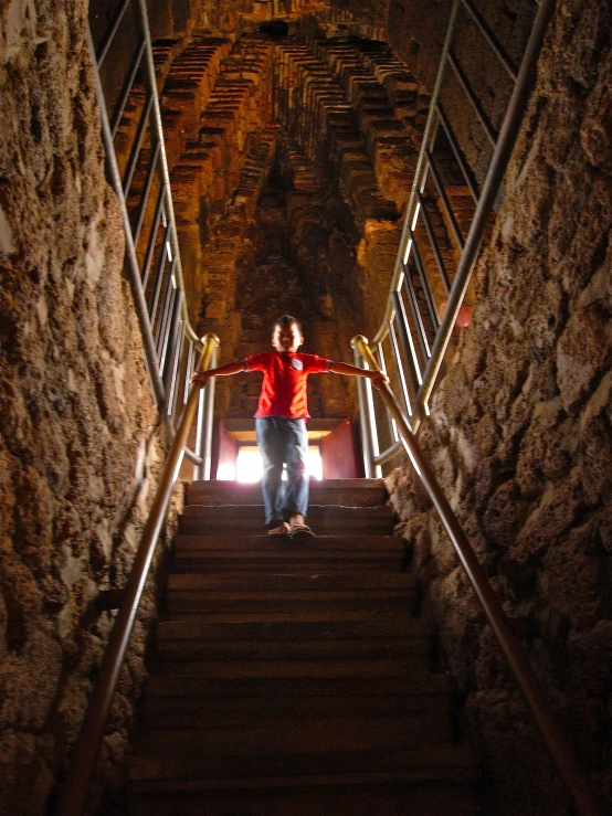 a person is standing in the light on some stairs