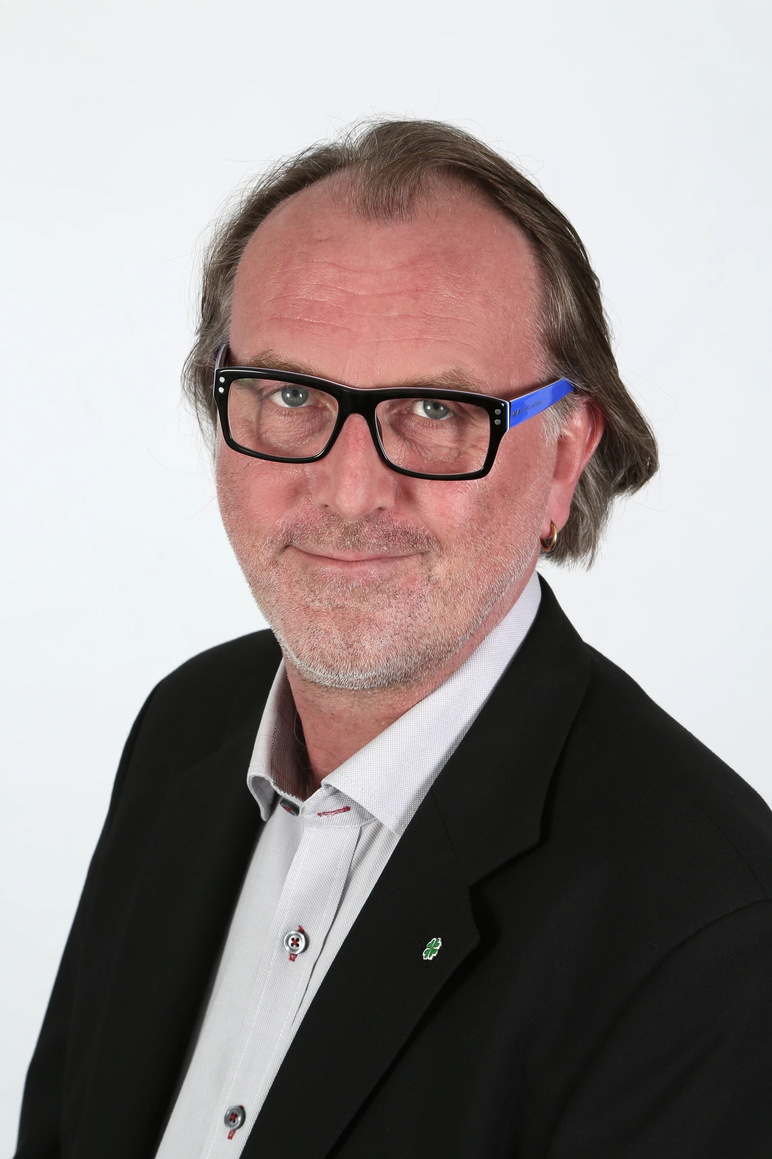 an image of a man with glasses on and beard