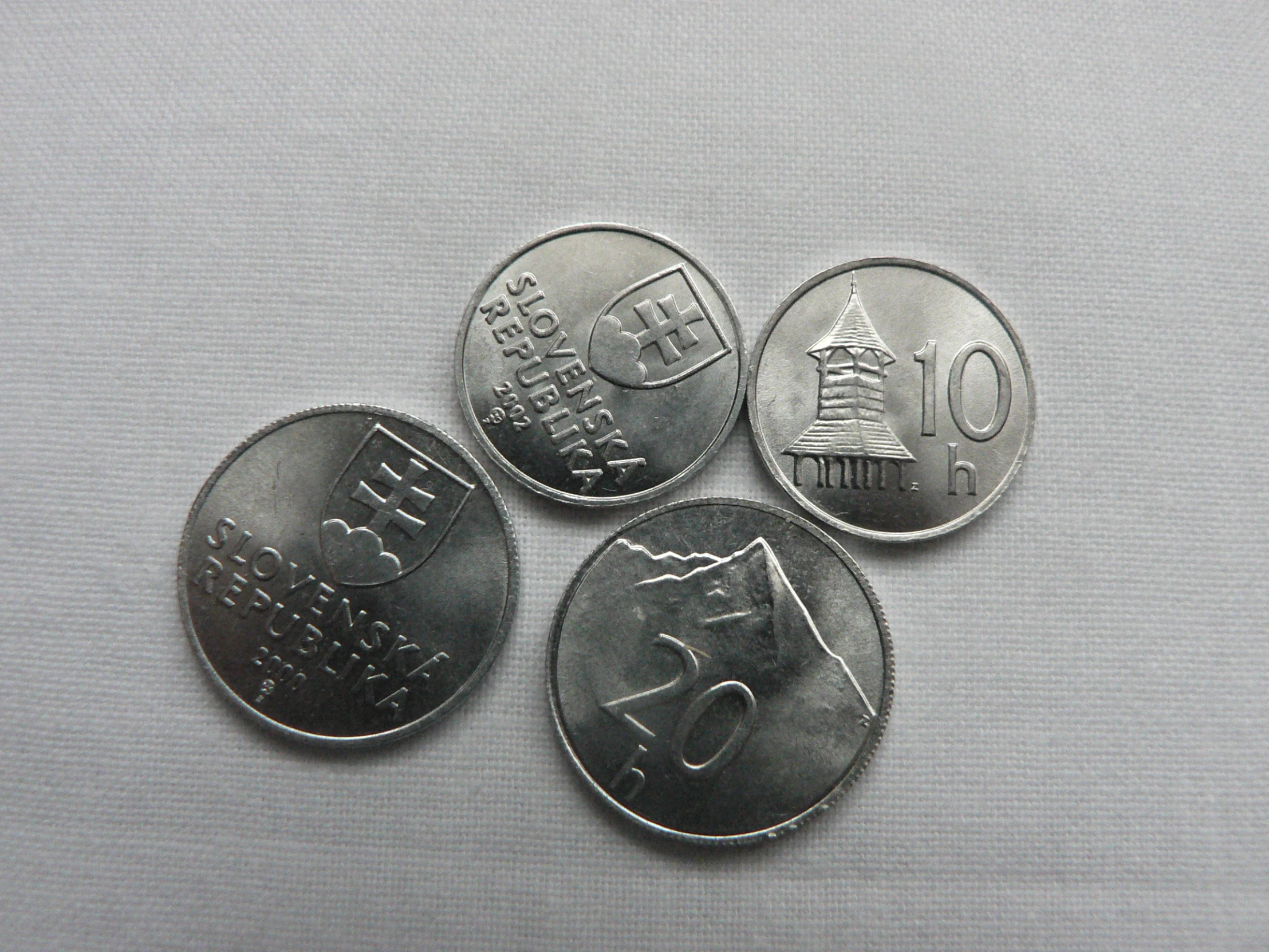 three coin with chinese characters are shown