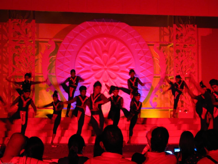 dancers performing in front of an audience at a concert