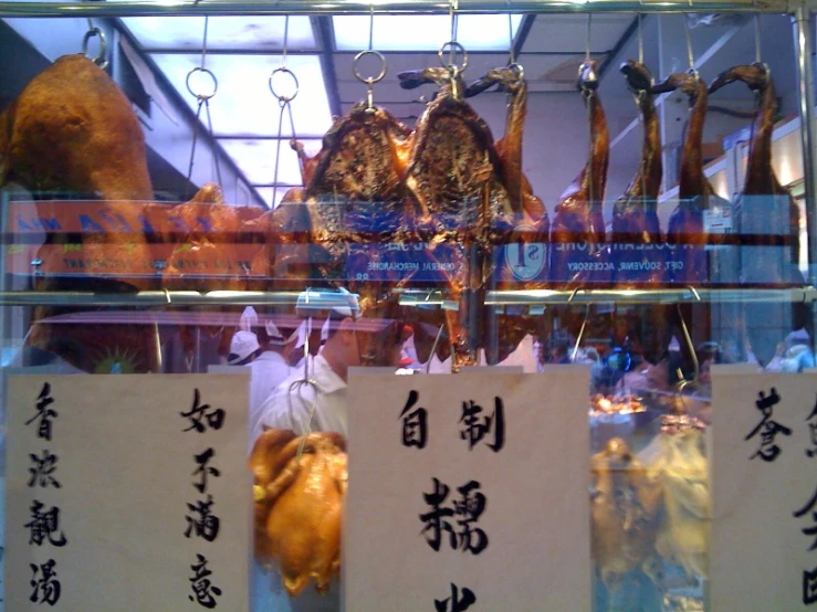 various meat products are displayed in display cases