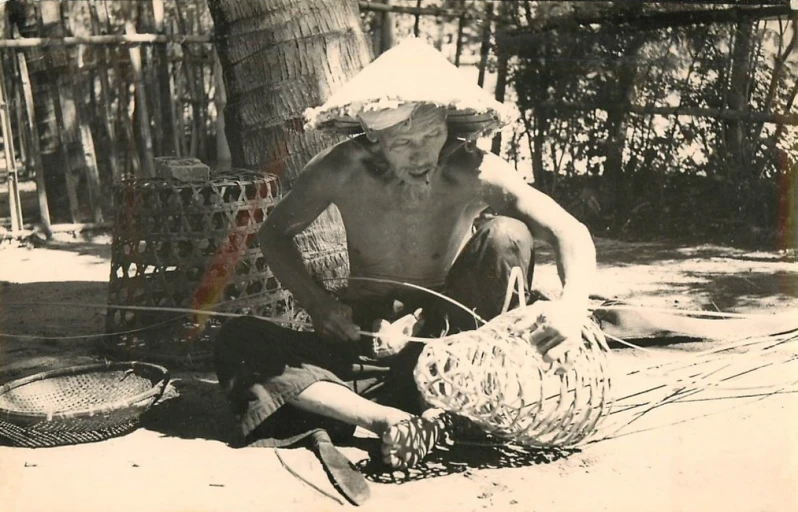 an old po of an older man with a big straw hat