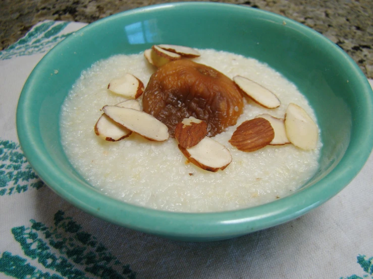 there is a bowl full of oatmeal and almonds