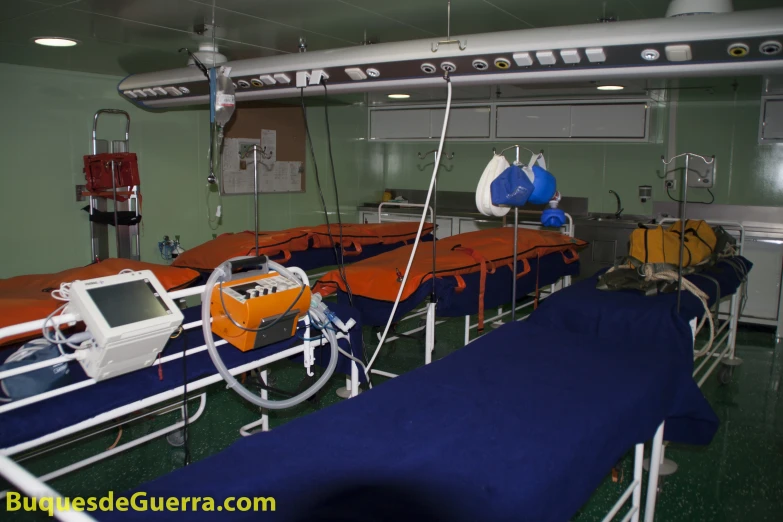 an operating room for several people with their beds hed up