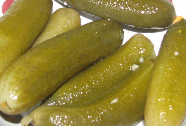 a close up of pickles in a plate