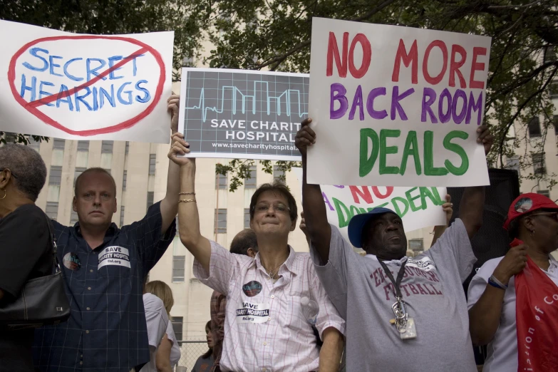 group of people holding protest signs that say no more sex than homosexuality