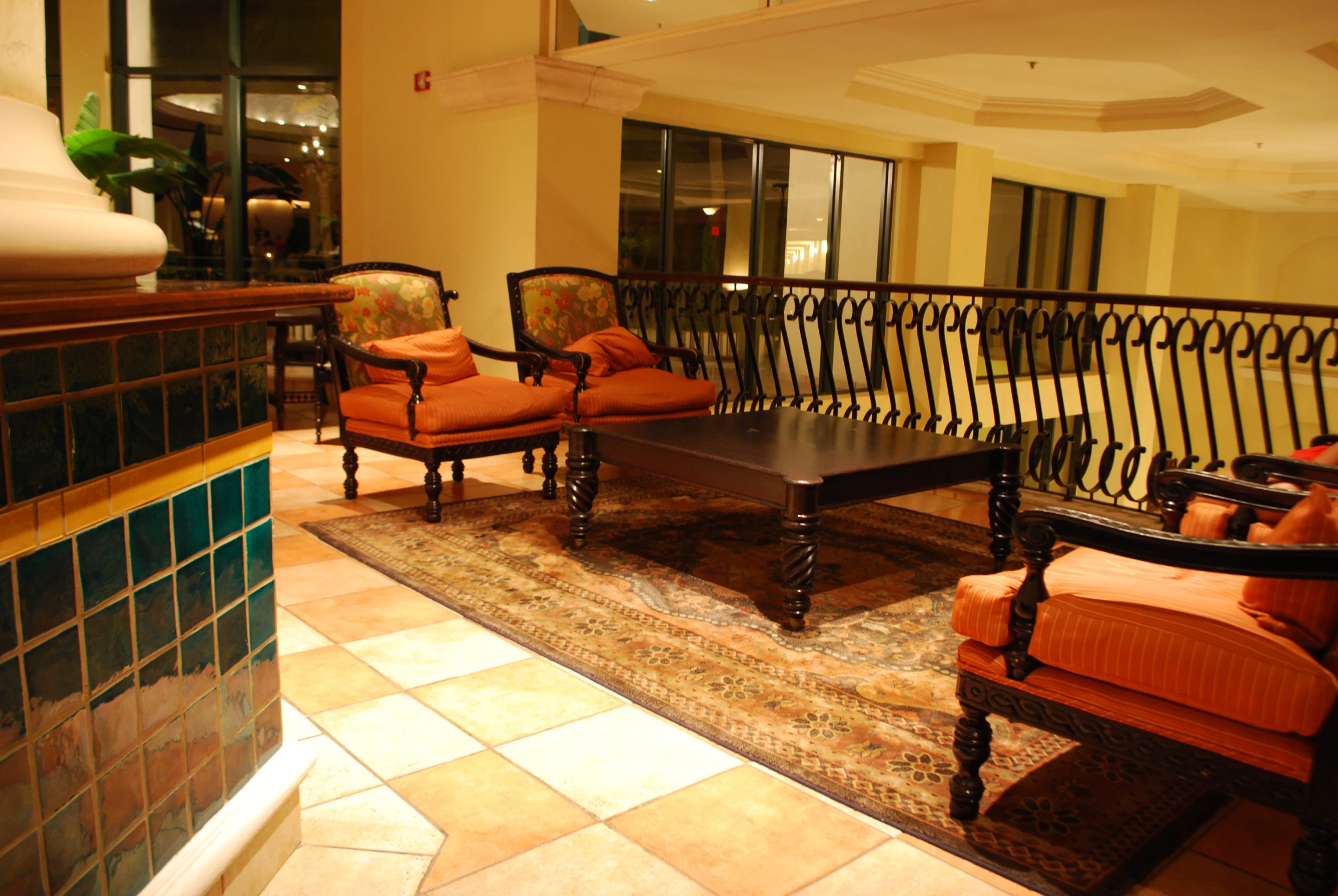 a el lobby with seating, rug and stairs