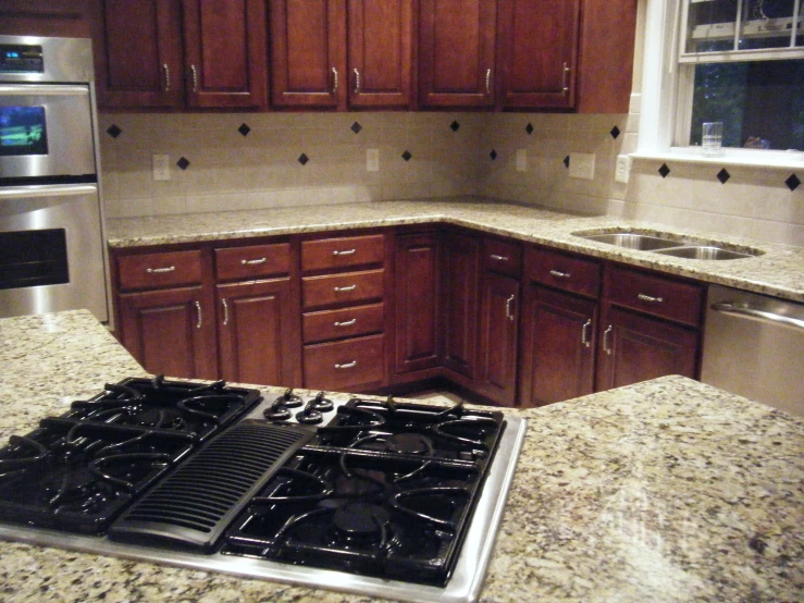 the sink and stove of this kitchen have been cleaned